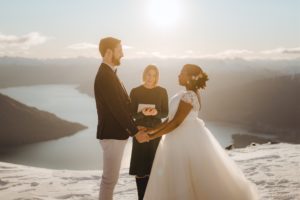Wedding ceremony at The Remarkables in Queenstown in the snow with bride, groom and celebrant