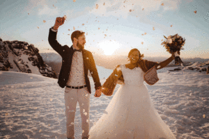 GIF video of bride and groom celebrating their Queenstown wedding on top of a mountain in snow