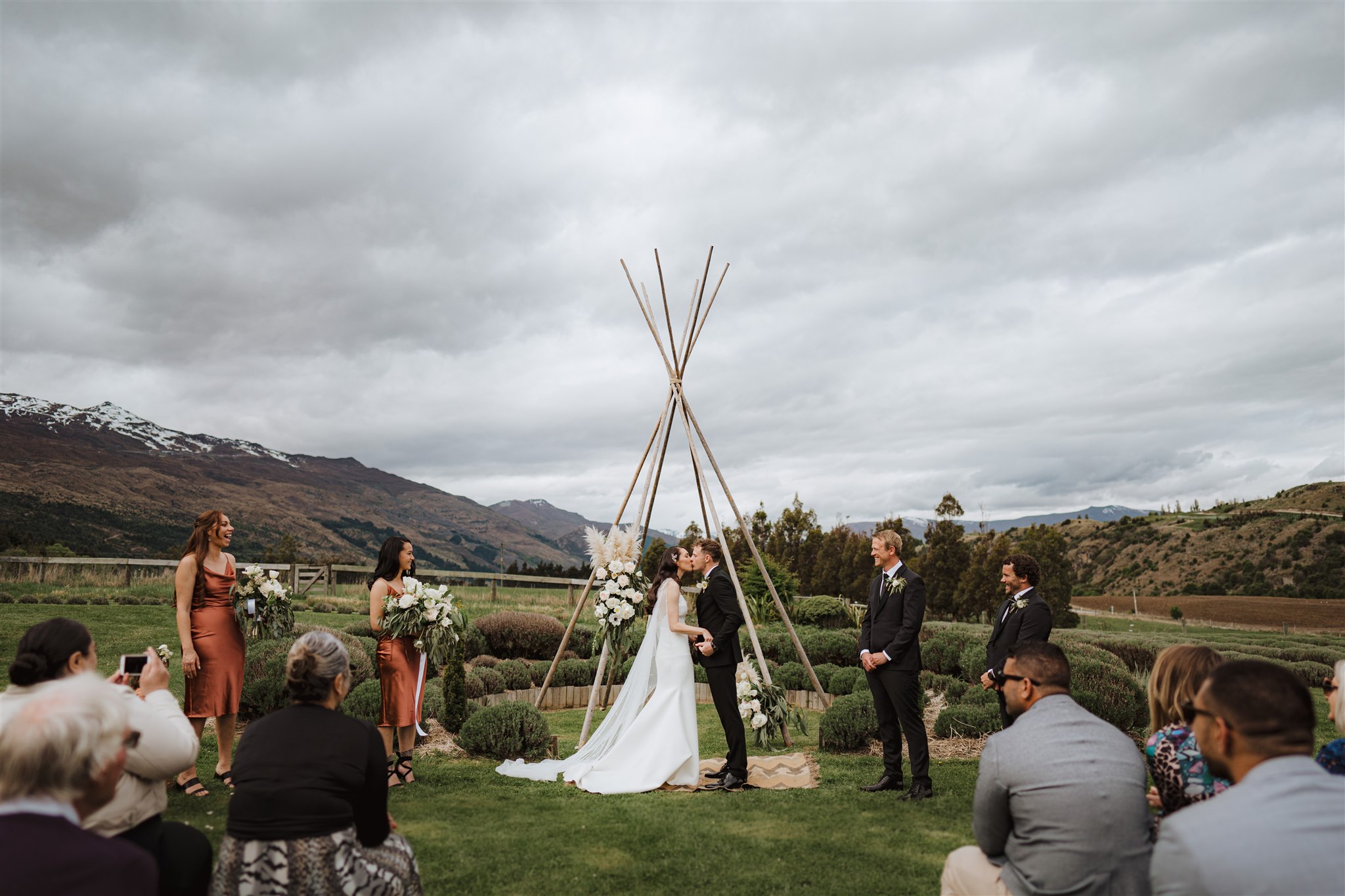 Wedding ceremony under tipi arch at Ben Lomond Lavender Farm in Queenstown, New Zealand