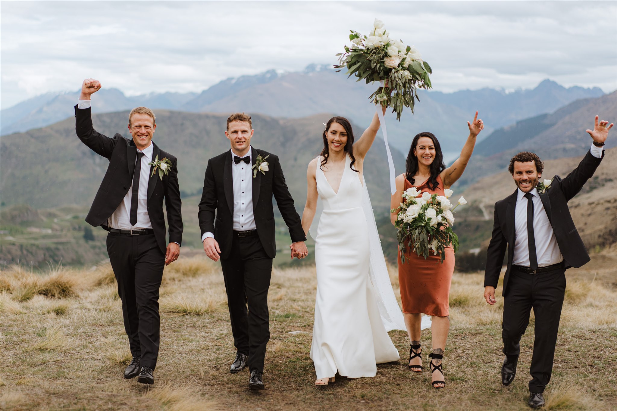 Bride and groom with bridal party at Coronet Peak in Queenstown, New Zealand