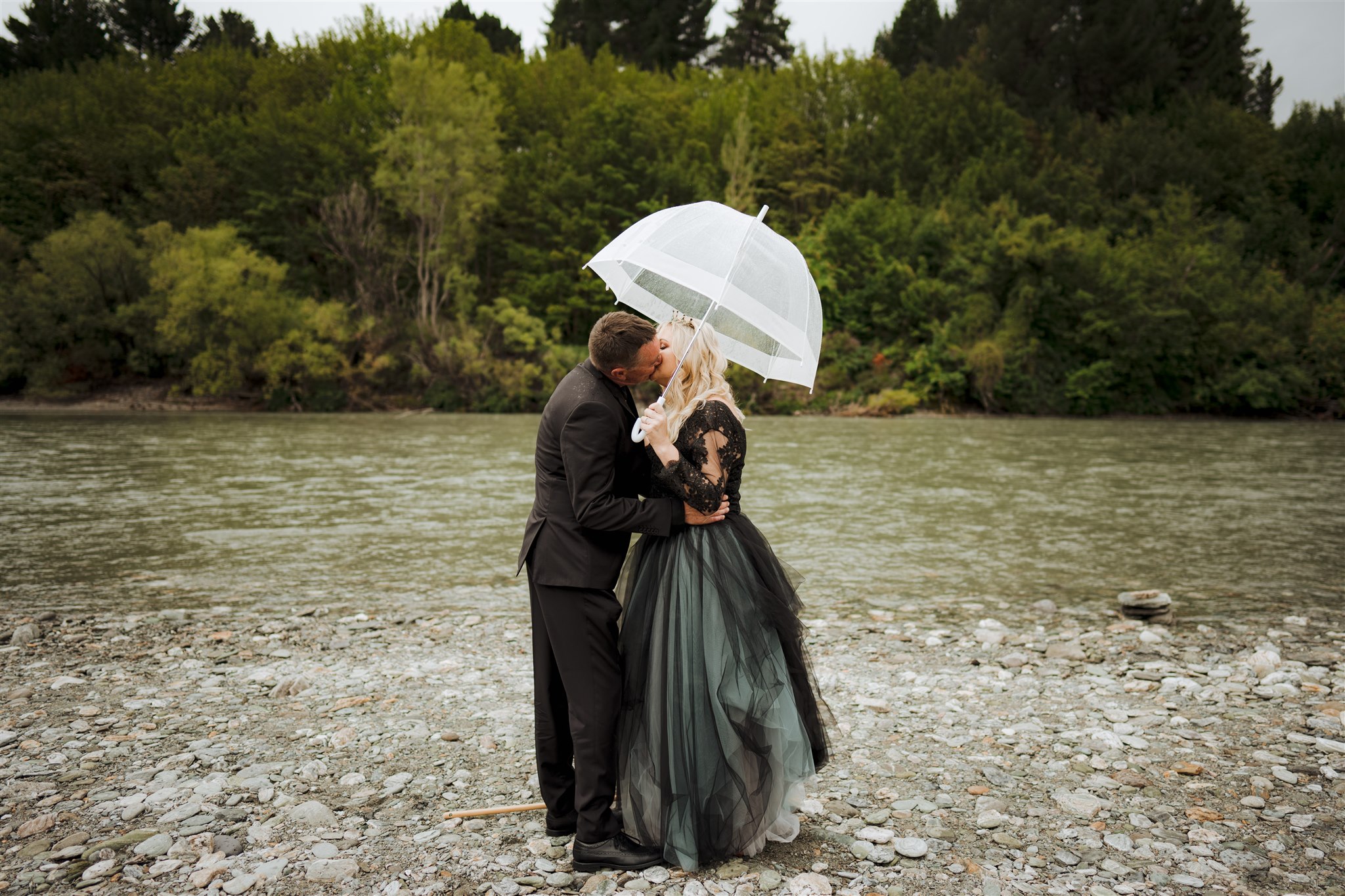 bride and groom first kiss at Queenstown wedding in New Zealand
