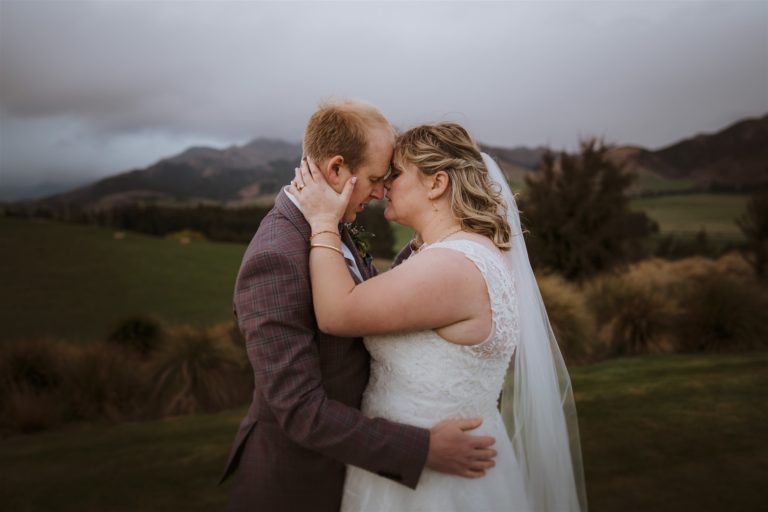 Bride and groom have an intimate cuddle on wedding day in Wanaka, New Zealand