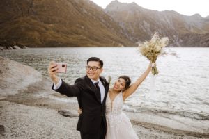 bride and groom take selfie after heli-wedding elopement ceremony at Lochnagar