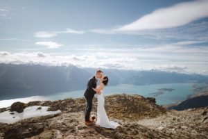 bride and groom's first kiss at Mount Crichton in Queenstown New Zealand