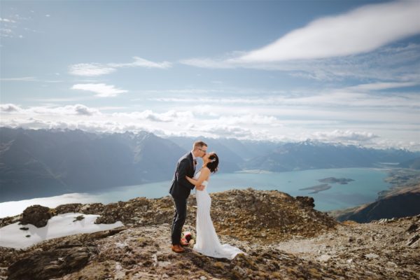 bride and groom's first kiss at Mount Crichton in Queenstown New Zealand