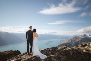 bride and groom looking at the view from Mount Crichton, Queenstown, New Zealand